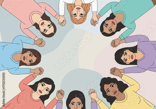 A group of diverse women holding hands in a circle, viewed from above.