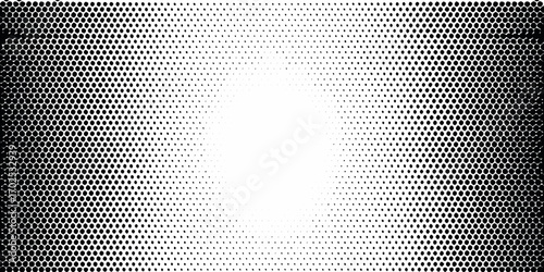 Black and white halftone dot pattern with a gradient effect from dense to sparse