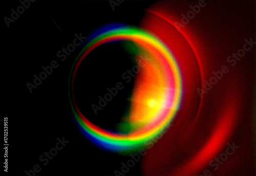 Abstract Circular Light Spectrum with Lens Flare and Prism Effect on a Dark Background - Vibrant Colors