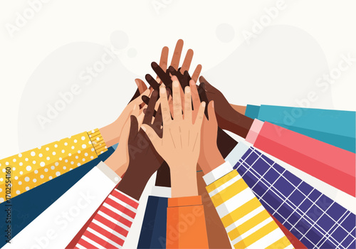 Diverse hands reaching together in a show of unity and teamwork.