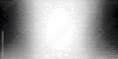 Abstract black and white diamond halftone pattern fading from dark edges to a bright center