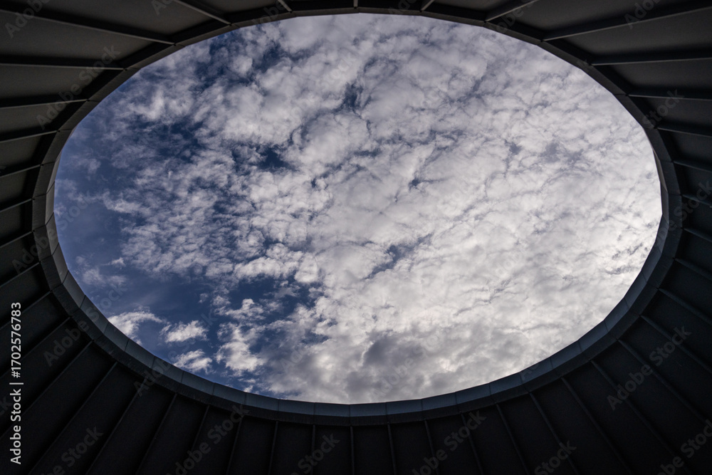 Fototapeta premium cloudy sky viewed through the ceiling hole of the observatory