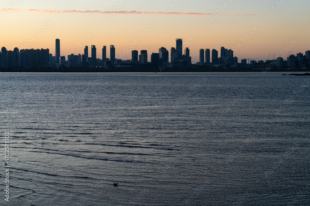 Fototapeta premium seaside city in dusk during sunset