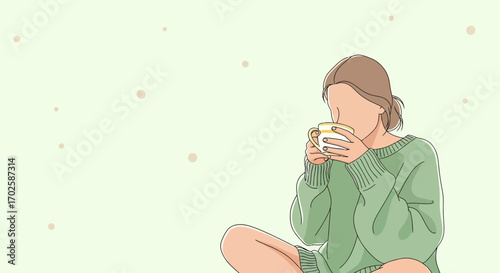 Young Woman Enjoying A Warm Drink While Feeling Relaxed And Comfortable At Home