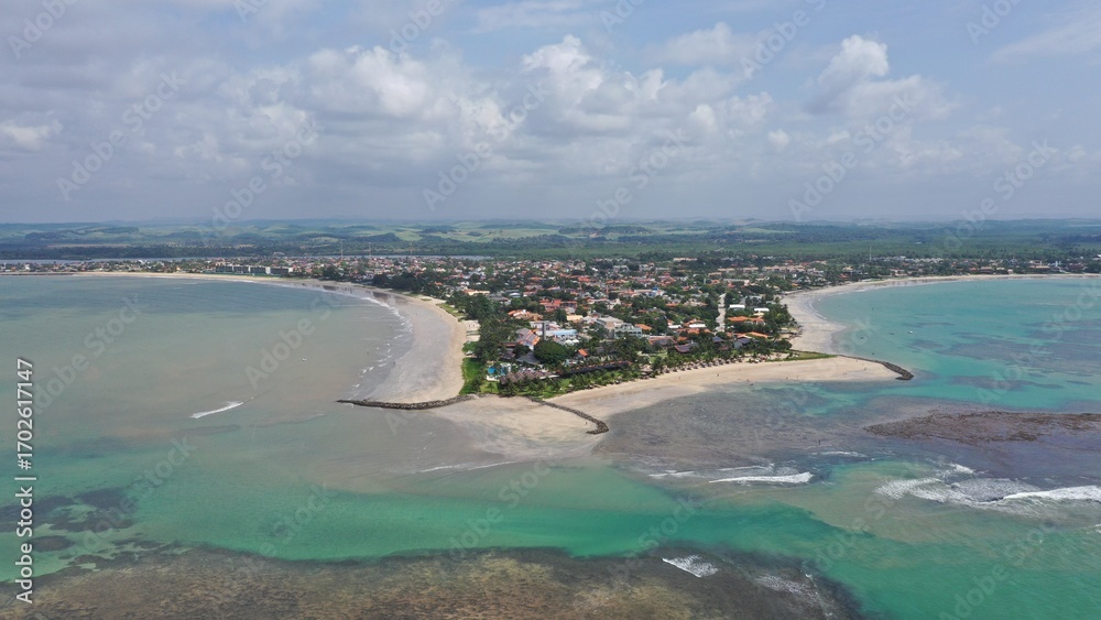 Fototapeta premium Fantastic panoramic view of Serrambi beach with coral reefs, natural swimming pools in the sea, white sand and palm trees. Serrambi near Recife in Pernambuco State, Brazil 