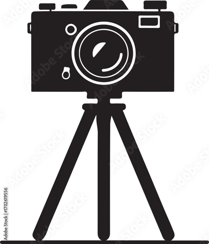 Silhouette of a vintage camera on a tripod retro