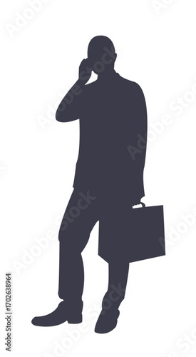 Silhouette of a Businessman Engaged in a Phone Call: A business-suited figure in silhouette engages in a focused phone call, clutching a briefcase, symbolizing modern professional communication. 