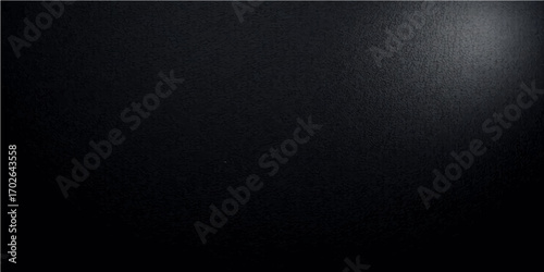 Rough, vintage black and white paper texture with a macro close-up of a dark textile pattern