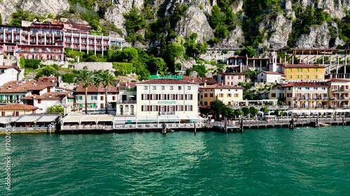Limone sul Garda old town. Aerial 4K video footage of panoramic lake Garda and Italian Alps mountains. Lombardy drone landscape of downtown