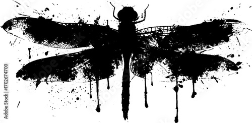 Black ink dragonfly silhouette with grunge splatter effect for artistic design