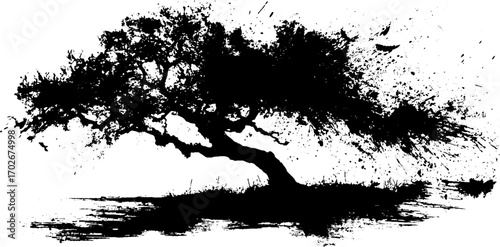 Black ink grunge silhouette of splattered tree for urban art design