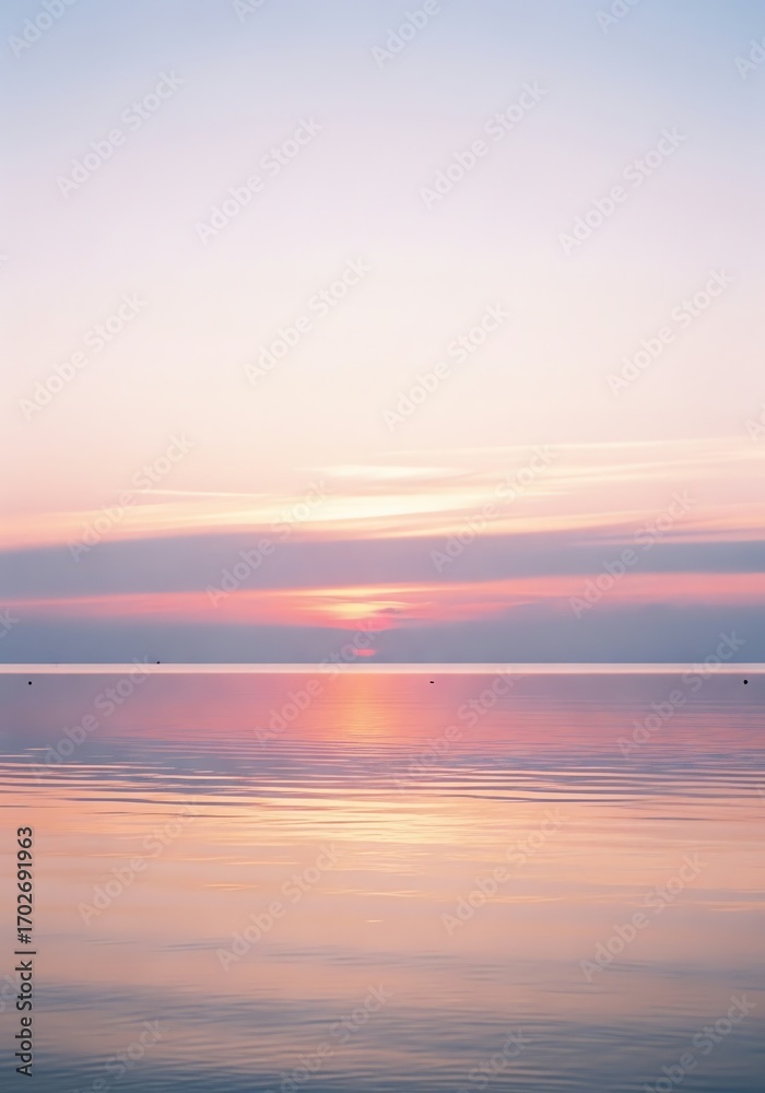 Naklejka premium Pastel Sunrise Reflecting on Calm Ocean Waters Serene Beauty