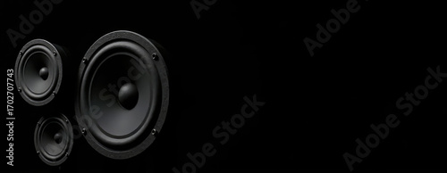 Black acoustic speakers and speakers on dark background. Disco music, intro, banner