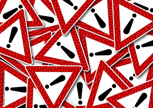 Multiple red and white triangular warning signs with exclamation marks overlapping in chaotic pattern. llustration representing danger, alert, caution, and emergency notification concepts with bold re