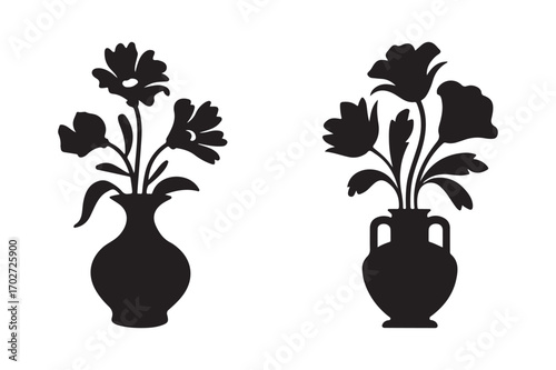 Two silhouette flower vases with floral arrangements