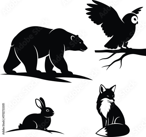 Silhouette illustration of woodland animals including a bear owl fox and rabbit in black and white vector format great for logos or prints