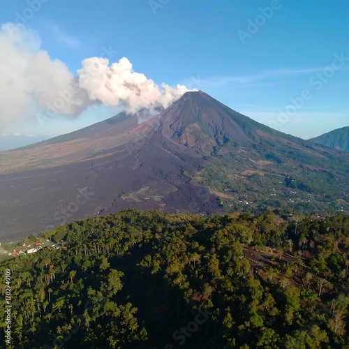 Volcanic mountain peak with smoke