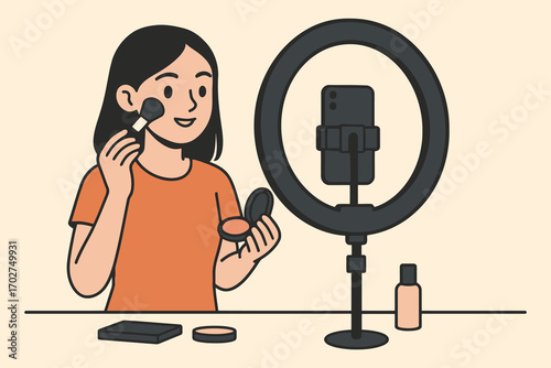 Young woman applying makeup in front of ring light and microphone