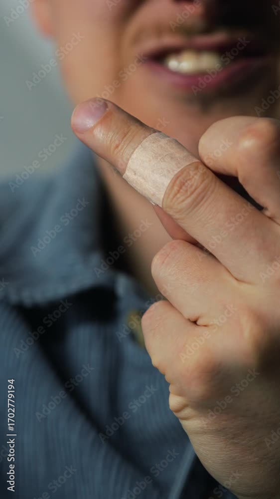 A person uses an antibacterial medical bandage to protect an open ...