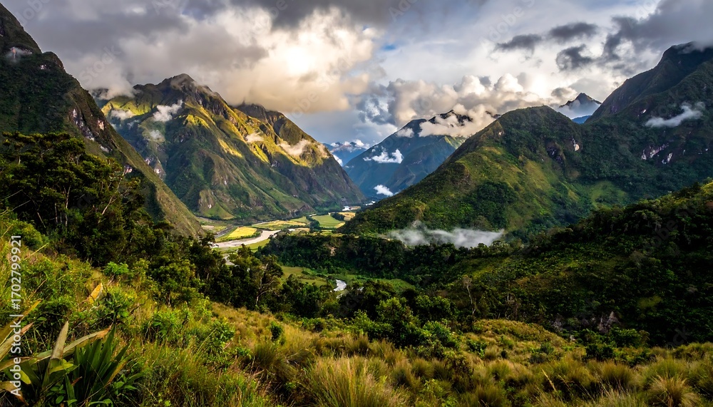 Fototapeta premium Lush valley nestled in mountainous terrain