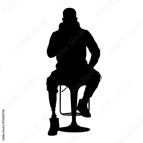 Confident individual with prosthetic limb confidently seated on modern stool, embodying resilience and strength for diverse storytelling needs.