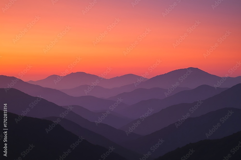 Fototapeta premium Layers of mountains at sunset create a serene and scenic landscape