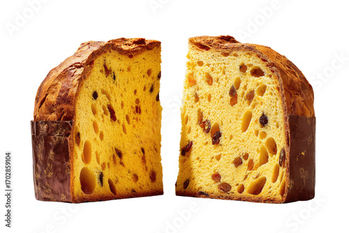 Two halves of a richly colored panettone, sliced through the center, showing the golden interior and dried fruit