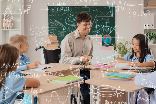 Male teacher in wheelchair ...