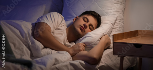 Handsome young man sleeping...