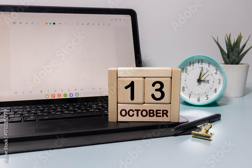Save the Date written on a calendar - October 13,
