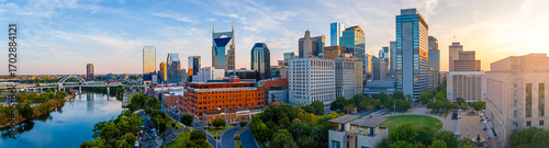 Panoramic view of Nashville skyline at sunset with river, skyscrapers, and city landmarks