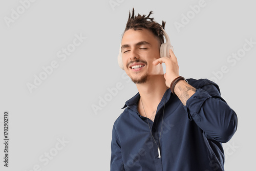 Young man with dreadlocks a...