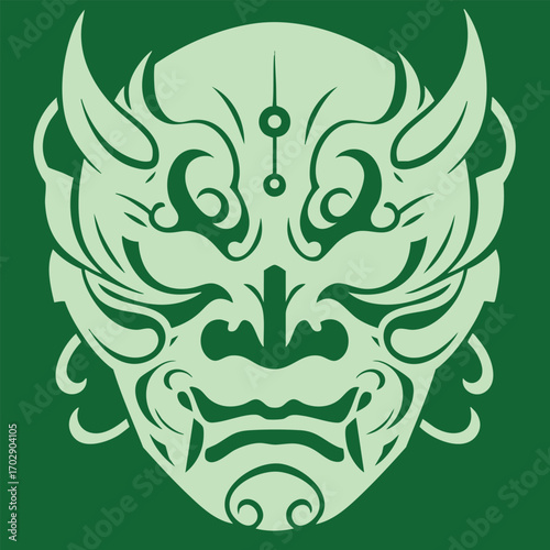 Intricate stylized green tribal mask design with symmetrical patterns and fierce facial expression on dark background