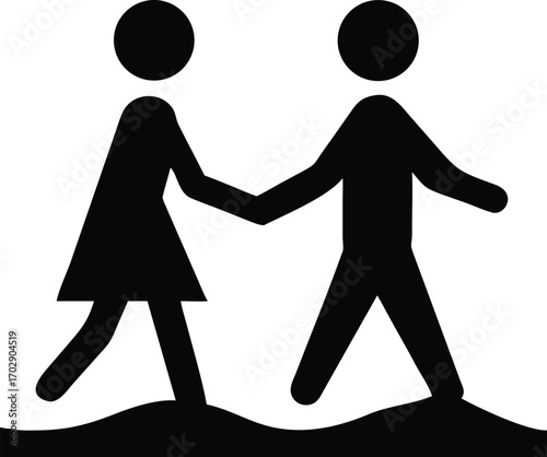 a couple walking hand in hand along the sandy beach