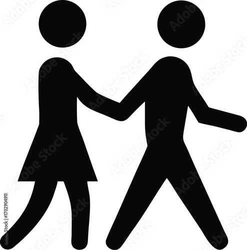 a couple walking hand in hand along sandy beach