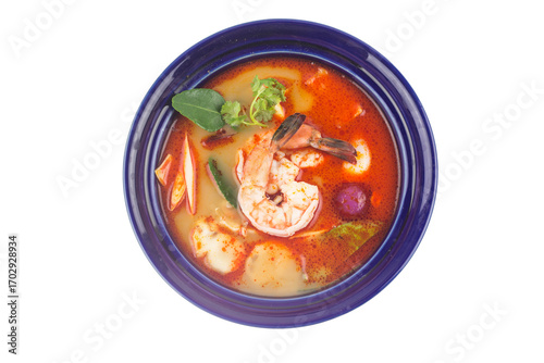 Tom Yam soup with shrimps, Thailand sour and spicy shrimp soup in blue plate on white background