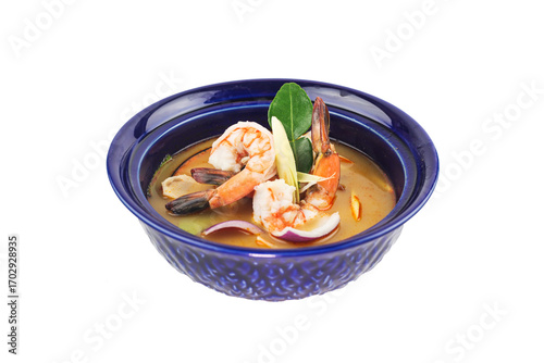 Tom Yam soup with shrimps, Thailand sour and spicy shrimp soup in blue plate on white background