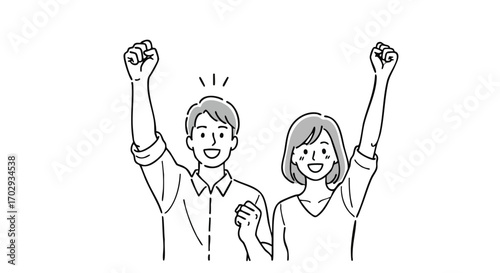 Excited couple celebrating success with raised fists, embodying triumph and achievement