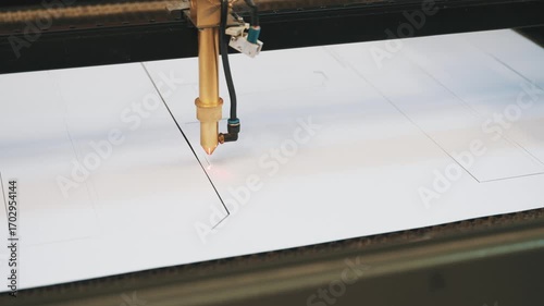 Innovative laser cutting technique shapes custom cardboard packaging in a dynamic manufacturing setup