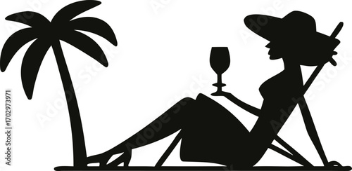 Woman relaxing with drink under palm tree silhouette