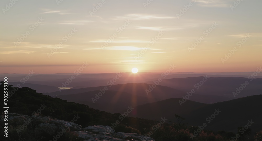 Obraz premium Sunset over mountain range, scenic landscape photography, golden hour, nature background, peaceful view
