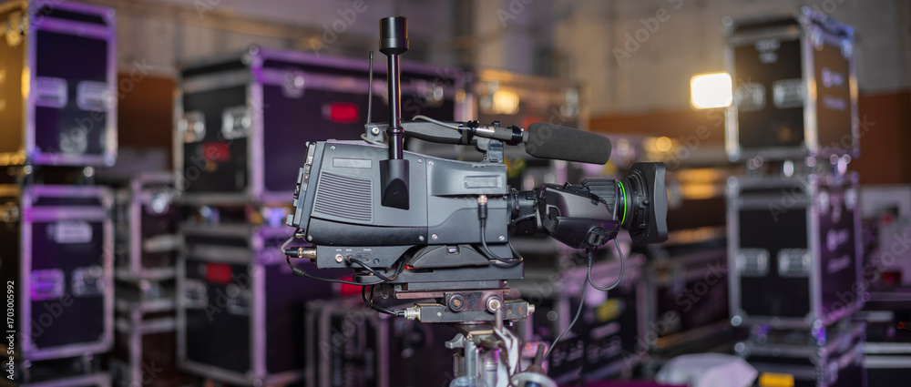 TV camera studio against the background of cases for equipment. TV camera studio against the background of cases for equipment.
