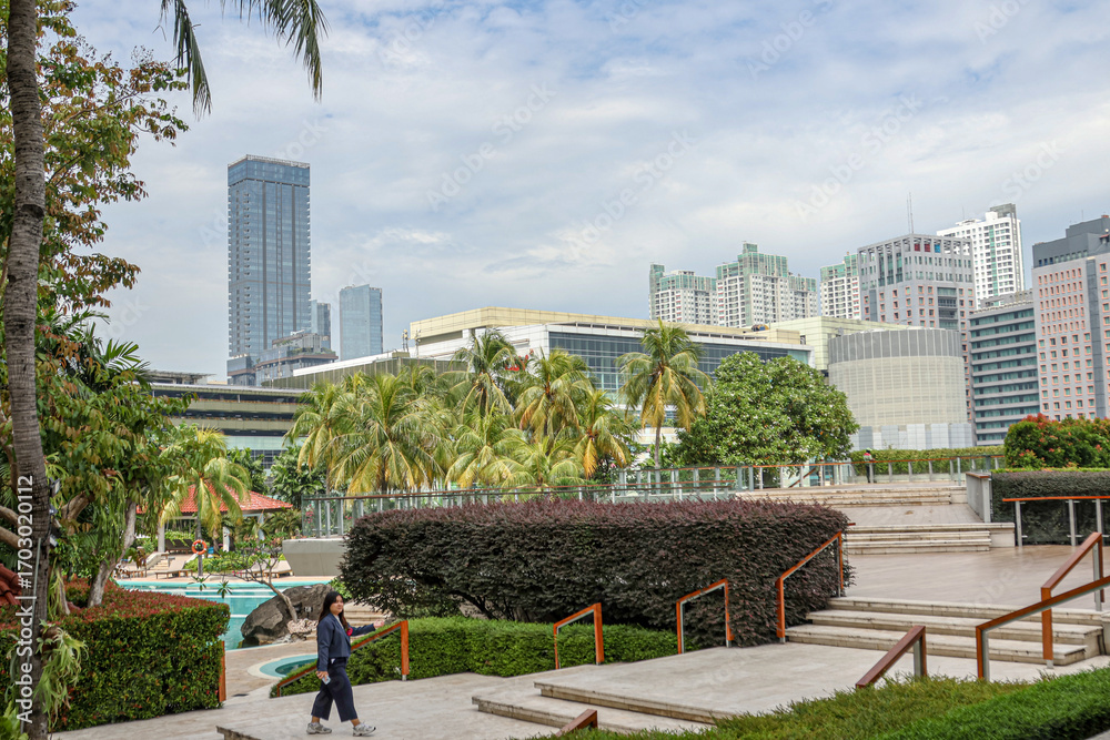 Fototapeta premium The atmosphere of the swimming pool in a luxury hotel in the city center. 