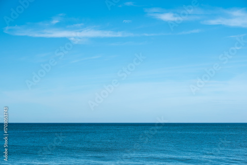 Nature of the ocean and blue sky Summer with sunshine, sandy beaches, clear blue waters sparkling against the blue sky. on an island with good ecology and environment Background for summer vacation