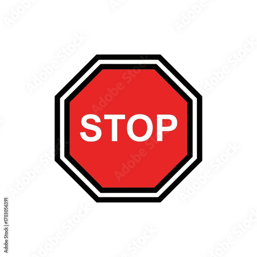 Stop sign indicates halting in traffic junction area