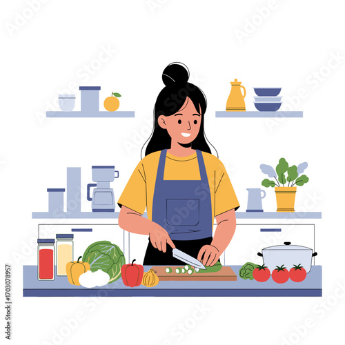 Young woman happily chopping vegetables in a modern kitchen.