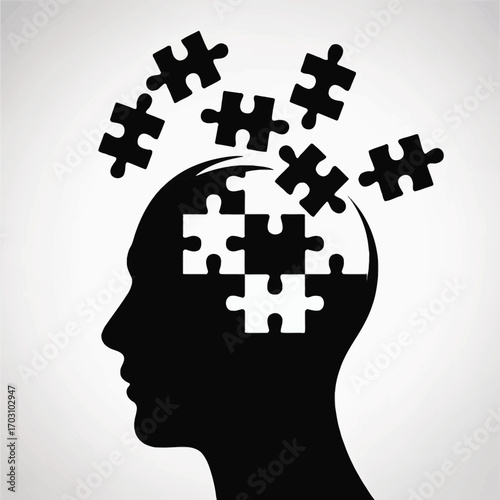 Black head profile with scattered puzzle pieces silhouette
