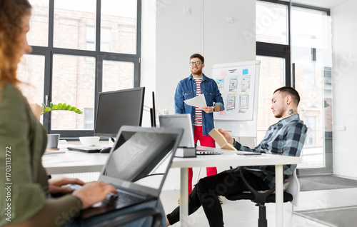 creative man showing user interface at office
