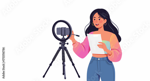 Young woman vlogging with a smartphone on a tripod and ring light, holding papers for a presentation or online content creation.