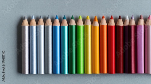 Vibrant Arrangement of Colorful Pencils on a Gray Background for Creative and Artistic Projects